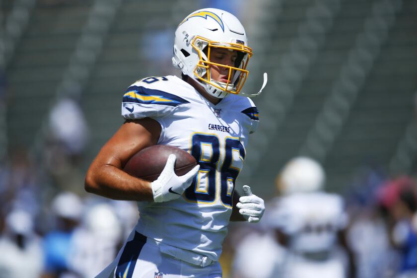 Los Angeles Chargers Hunter Henry warms up before a game against the Indianapolis Colts in Carson on Sept. 8, 2019.