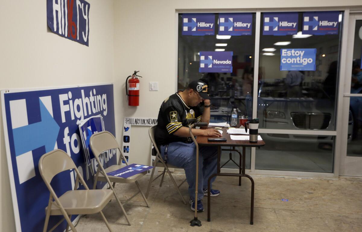 HENDERSON, NV- Peni Mene Sua, 55, of Henderson, makes phone calls at the Hillary for Nevada office in Henderson, NV. He said he had a traumatic brain injury, and as part of his speech therapy he volunteers to make calls to veterans on behalf of the Clinton campaign. (Francine Orr/ Los Angeles Times)