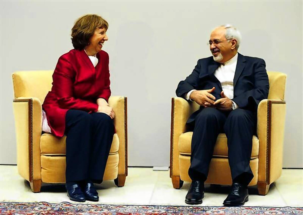 European Union foreign policy chief Catherine Ashton (L) speaks with Iranian Foreign Minister Mohammad Javad Zarif.
