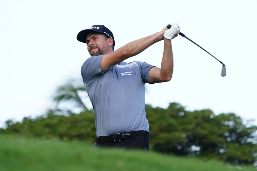 Webb Simpson plays his shot from the 11th tee during the Sony Open golf tournament pro-am event, Wednesday, Jan. 12, 2022, at Waialae Country Club in Honolulu. (AP Photo/Matt York)