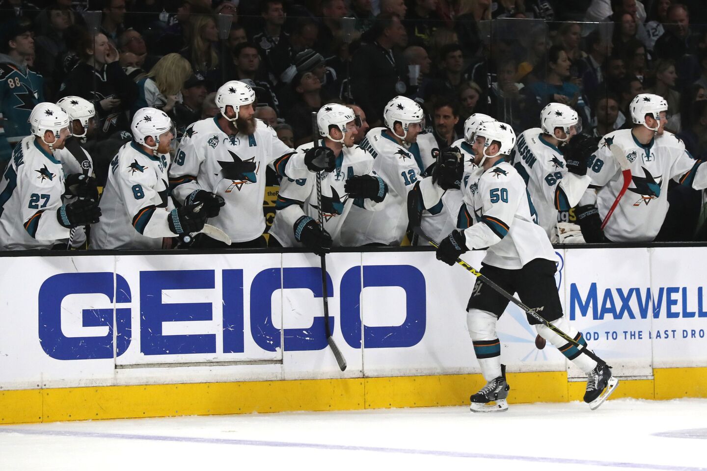 Sharks forward Chris Tierney high fives teammates after scoring a first period goal against the Kings in Game 5 of the first round playoff series on April 22.
