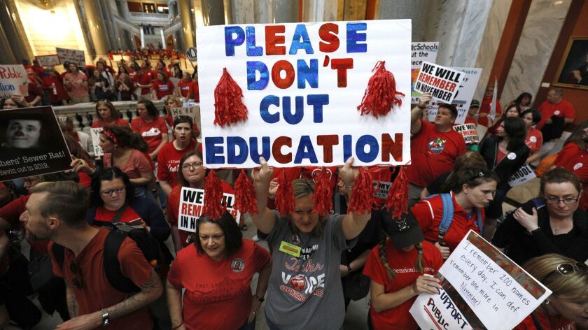 Kentucky public school teachers protest at the state capitol in Frankfort on April 13, 2018.