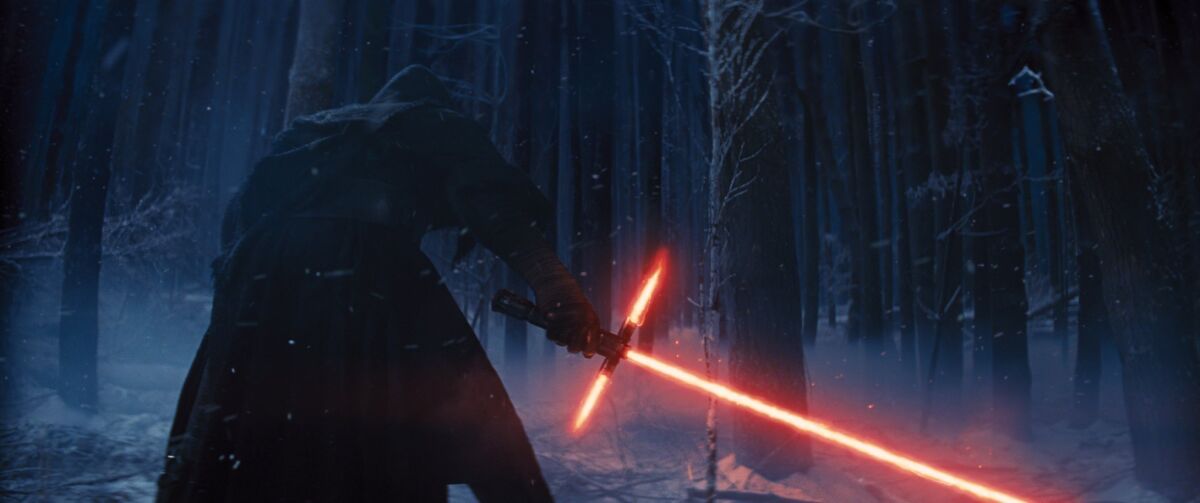 This photo provided by Disney shows, Adam Driver as Kylo Ren with his Lightsaber in a scene from the new film, "Star Wars: The Force Awakens." The movie releases in the U.S. on Dec. 18, 2015. (Film Frame/Disney/Copyright Lucasfilm 2015 via AP)