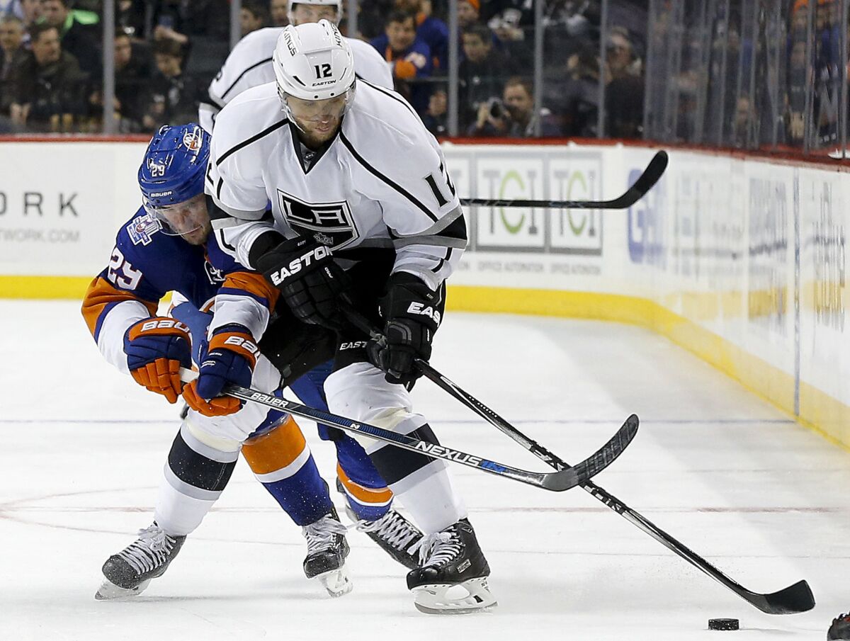 Islanders center Brock Nelson (29) battles for the puck against Kings right wing Marian Gaborik (12) during the third period of a game on Feb. 11.