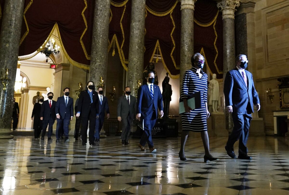 Clerk of the House Cheryl Johnson leads the Democratic House impeachment managers.