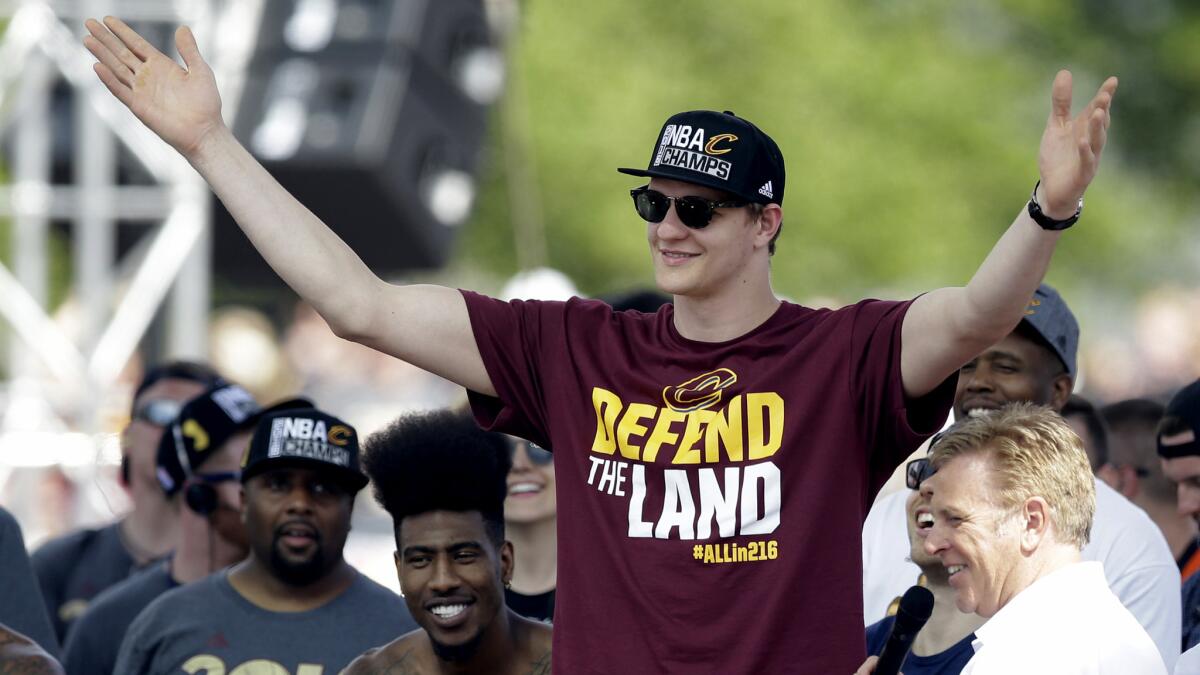 Timofey Mozgov gets ready to address fans during a rally June 22 in Cleveland following the Cavaliers' victory in the NBA Finals.