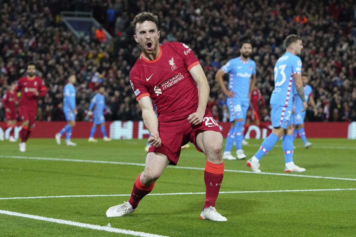 Liverpool's Diogo Jota celebrates after scoring his side's first goal during the Champions League group B soccer match between Liverpool and Atletico Madrid in Liverpool, England, Wednesday, Nov. 3, 2021.(AP Photo/Jon Super)