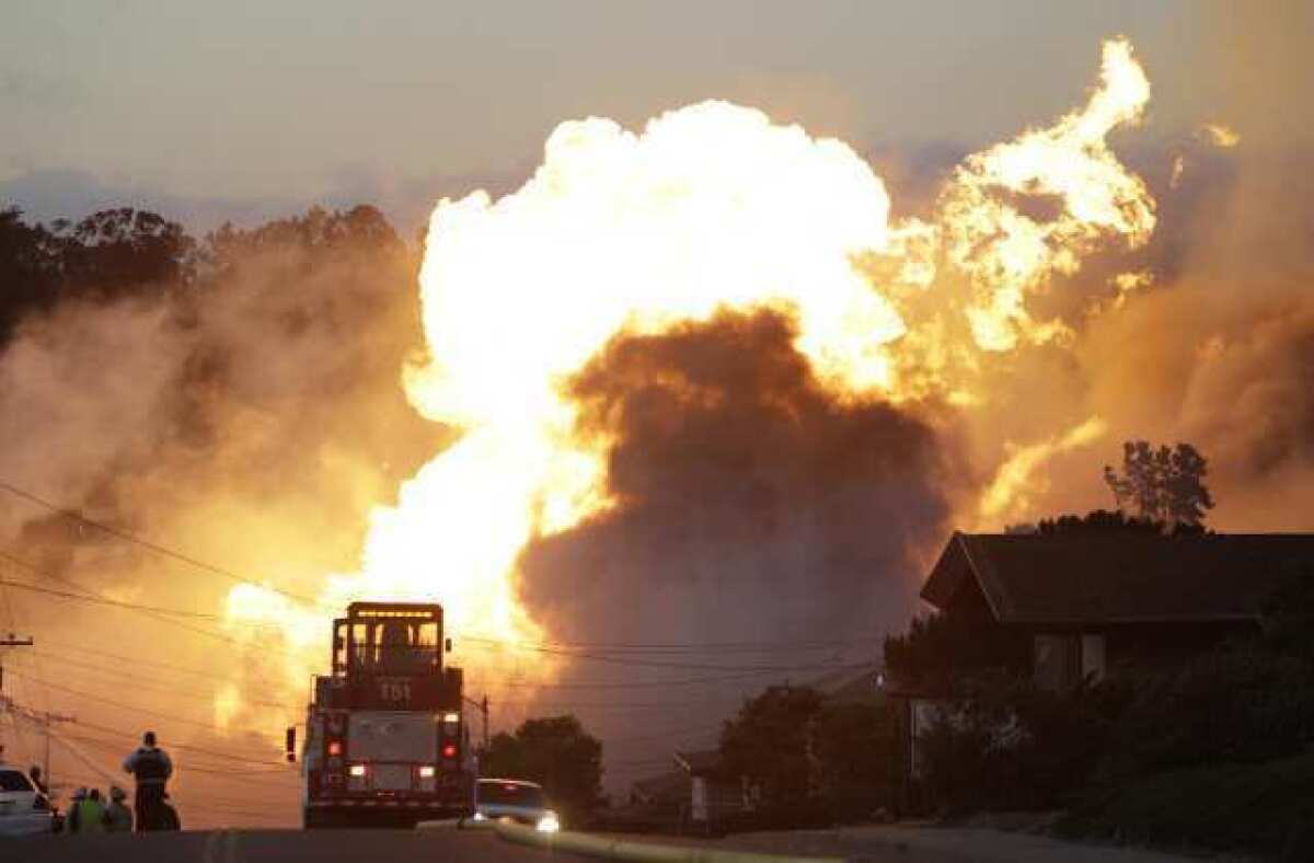 A massive fire roars through San Bruno, Calif., after a PG&E; natural gas pipeline explosion.