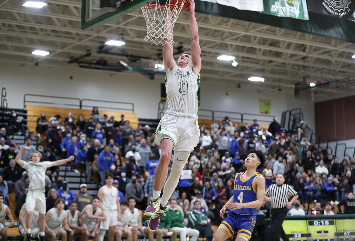 Edison's Tyler Hampton slam dunks in the semifinals of the CIF Southern Section Division 2A playoffs against La Mirada.