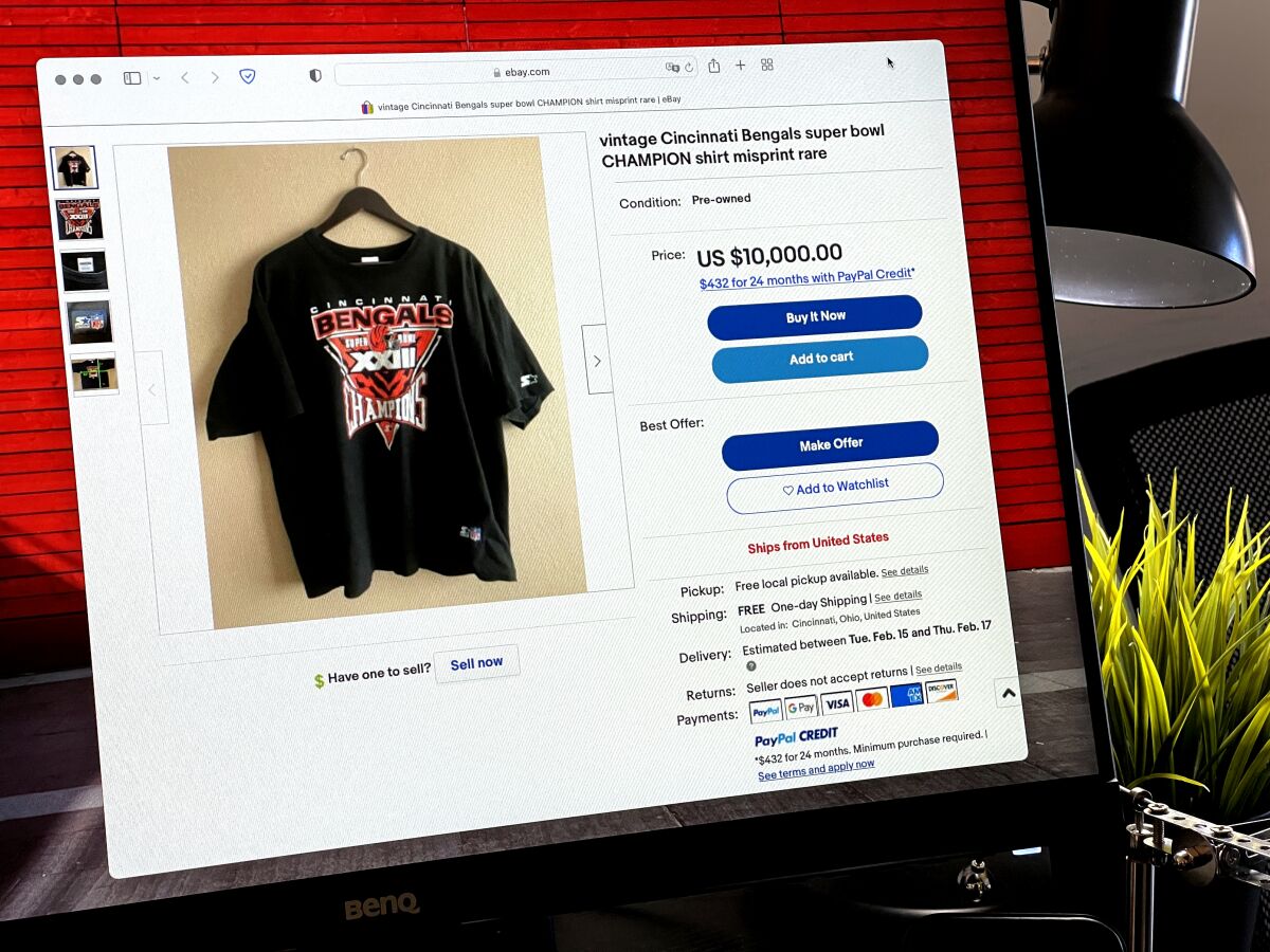 A computer screen with a photo of a T-shirt for sale.