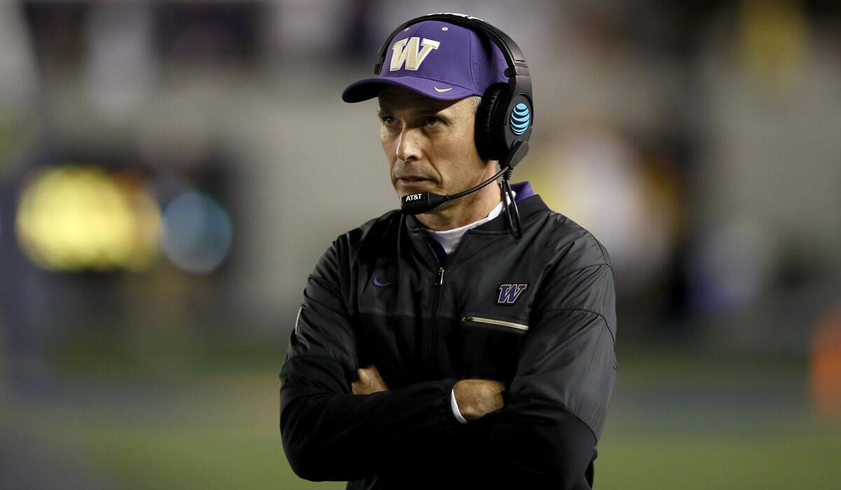 Washington Coach Chris Petersen walks the sidelines during the Huskies' game against California on Saturday.