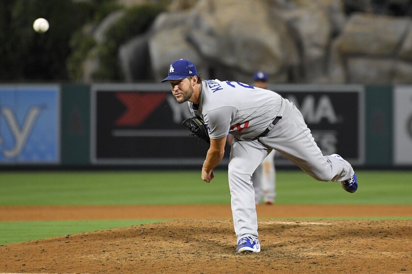 Dodgers starting pitcher Clayton Kershaw throws against the Angels in the eighth inning on Friday.