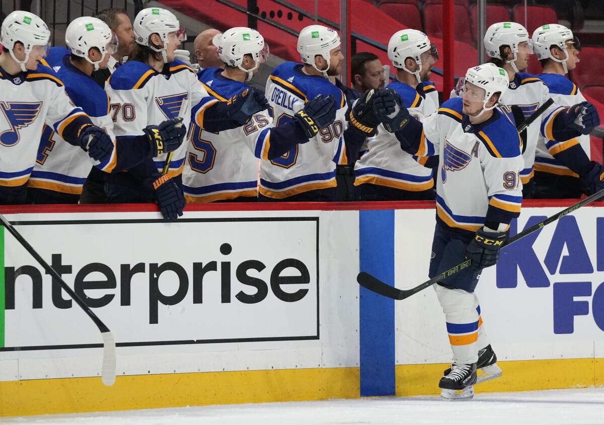 St. Louis Blues right wing Vladimir Tarasenko (91) is congratulated for his goal against the Ottawa Senators during the second period of an NHL hockey game Tuesday, Feb. 15, 2022, in Ottawa, Ontario. (Justin Tang/The Canadian Press via AP)