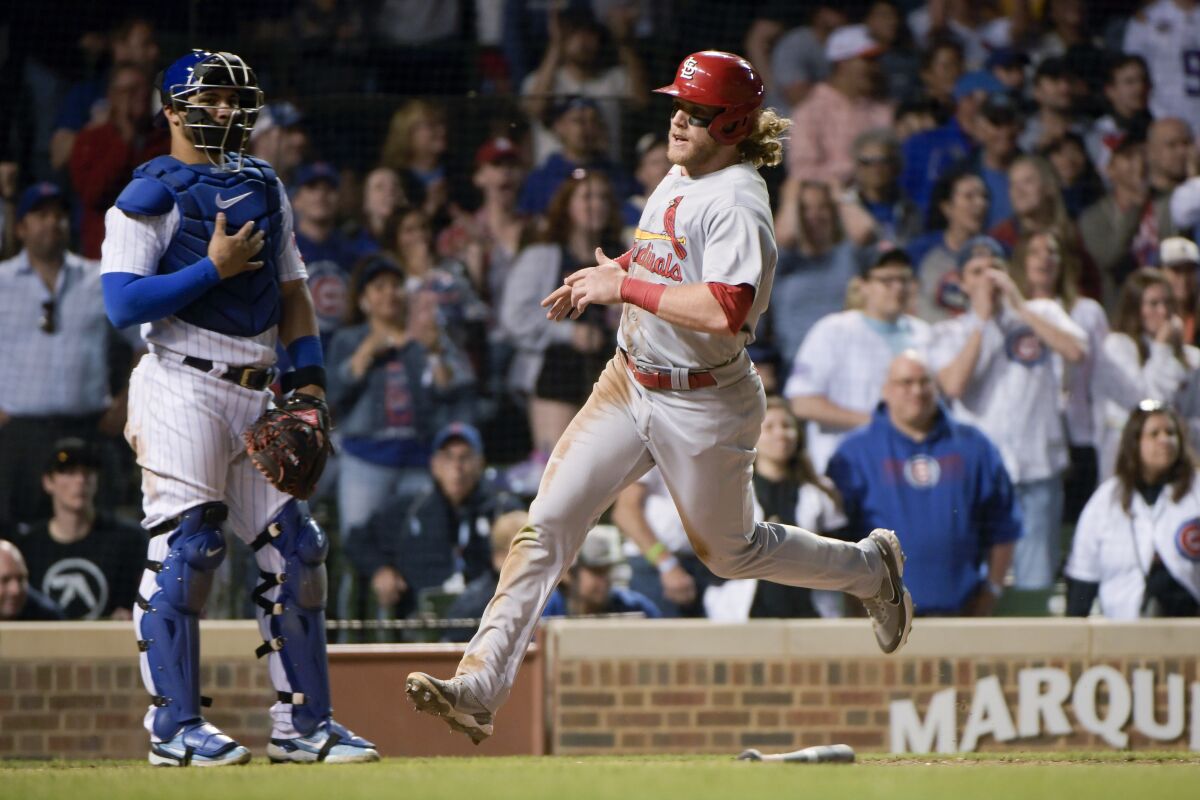 St. Louis Cardinals Harrison Bader scores the tying run against the Chicago Cubs during the ninth inning of a baseball game, Sunday, June 5, 2022, at Wrigley Field in Chicago. (AP Photo/Mark Black)