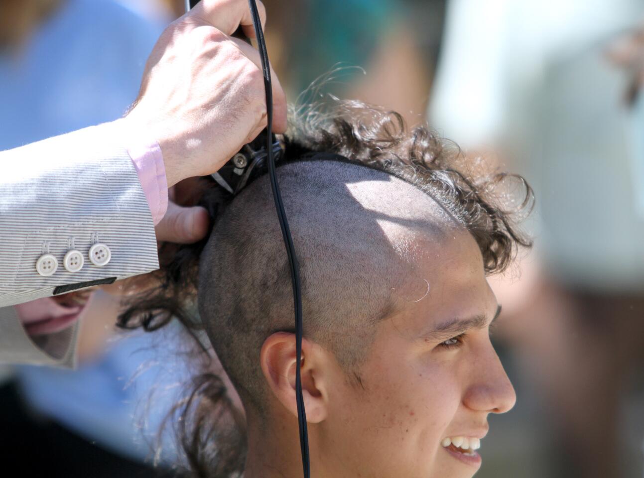 Photo Gallery: La Cañada High School students raise money by shaving heads on St. Baldrick's Day