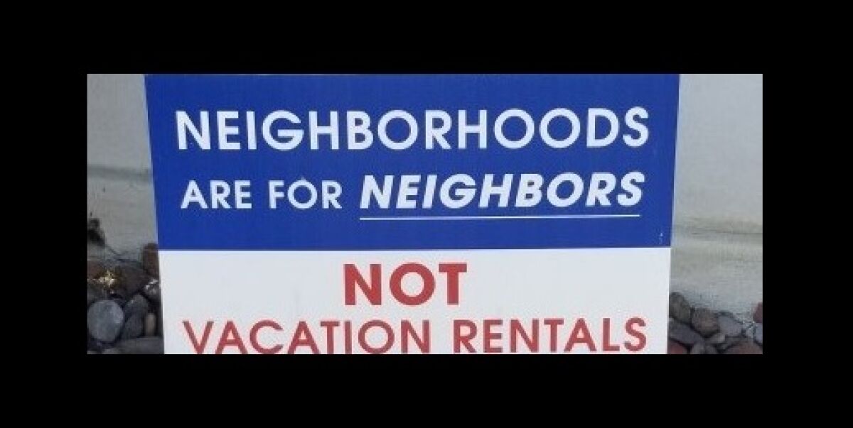 A yard sign speaks to the feelings that many community members have about short-term vacation rentals.