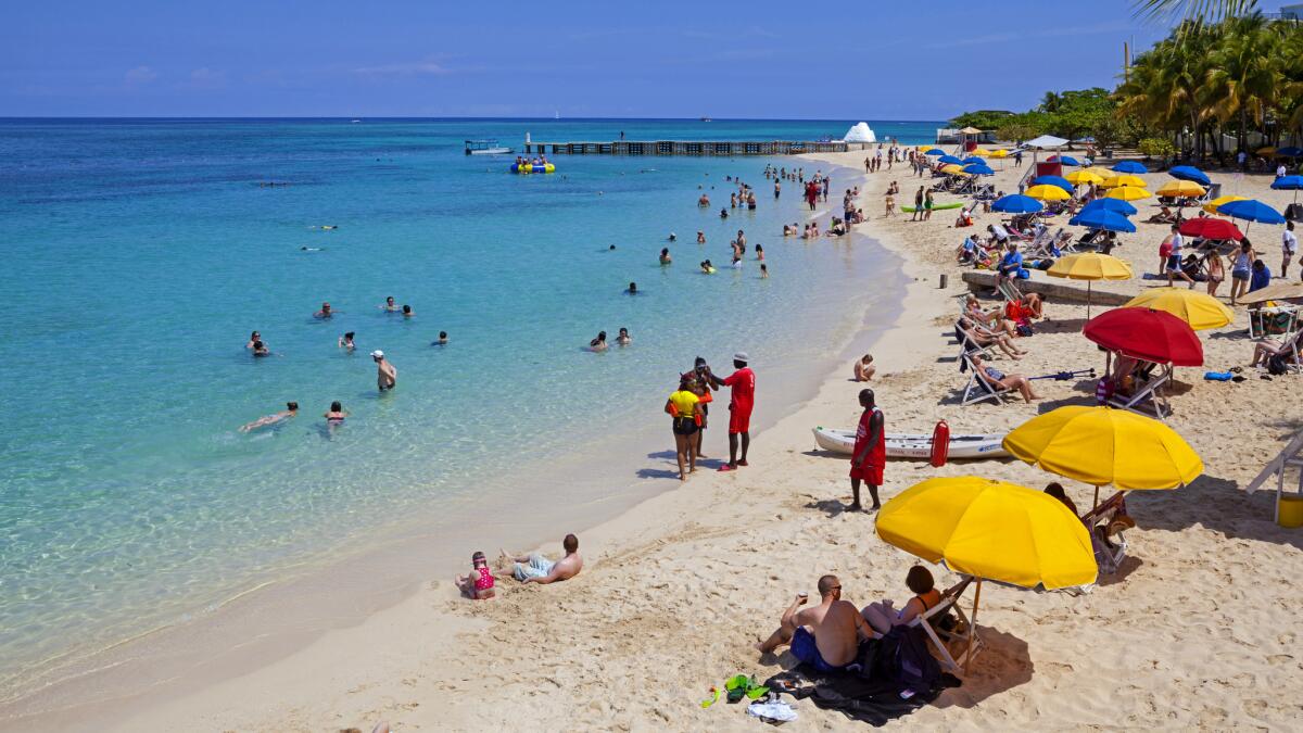 Doctor's Cave Beach on Montego Bay, Jamaica. The white sand is attractive, as is the $435 round-trip airfare from LAX.