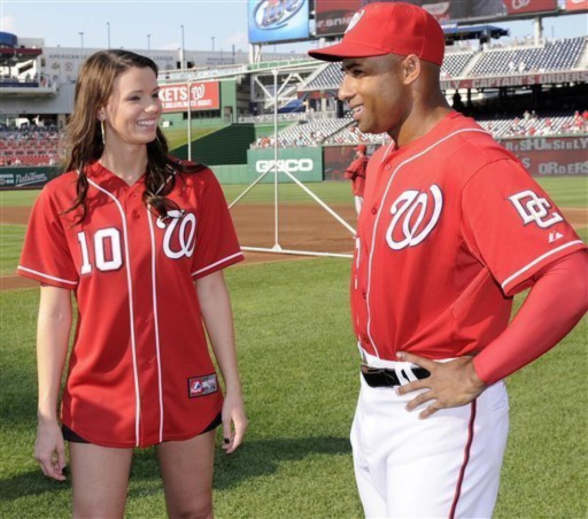 Washington Nationals baseball player Adam Dunn poses with his wife