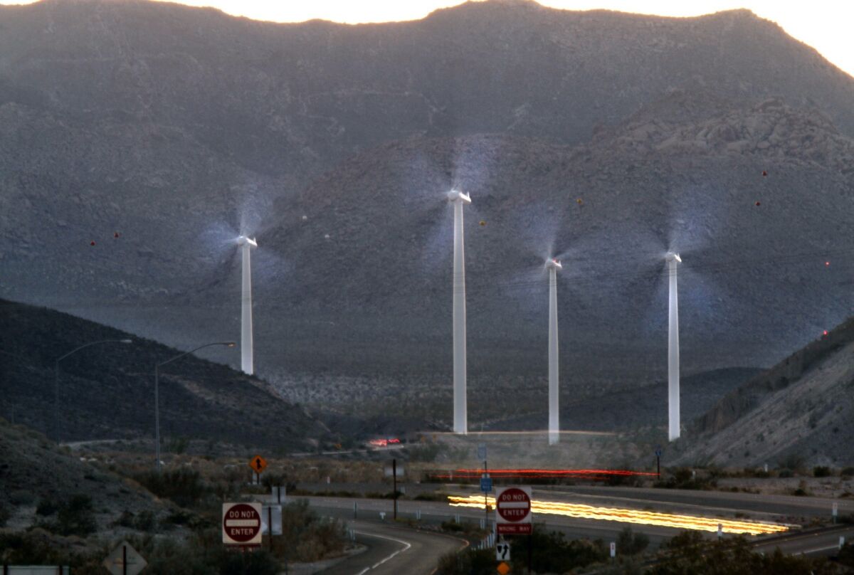 Wind turbines spin along Interstate 8 near Ocotillo, Calif.