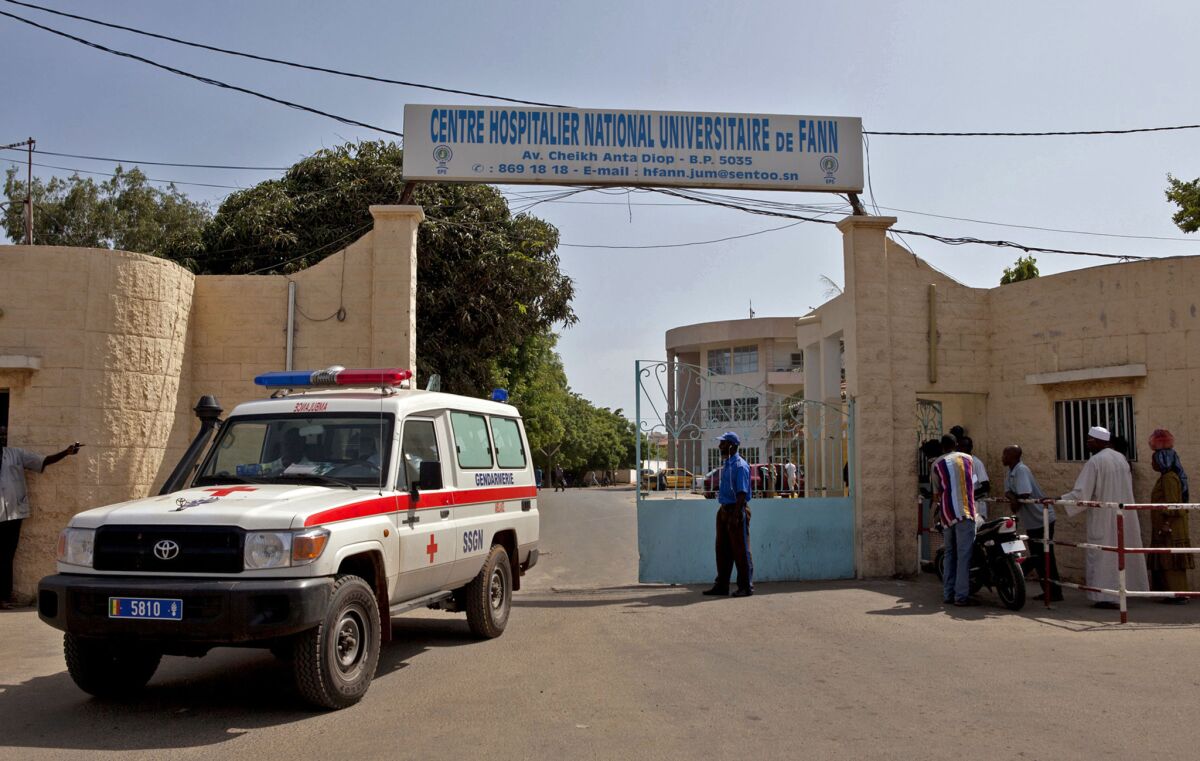 A ambulance leaves the hospital were a man is being treated for Ebola in Dakar, Senegal.