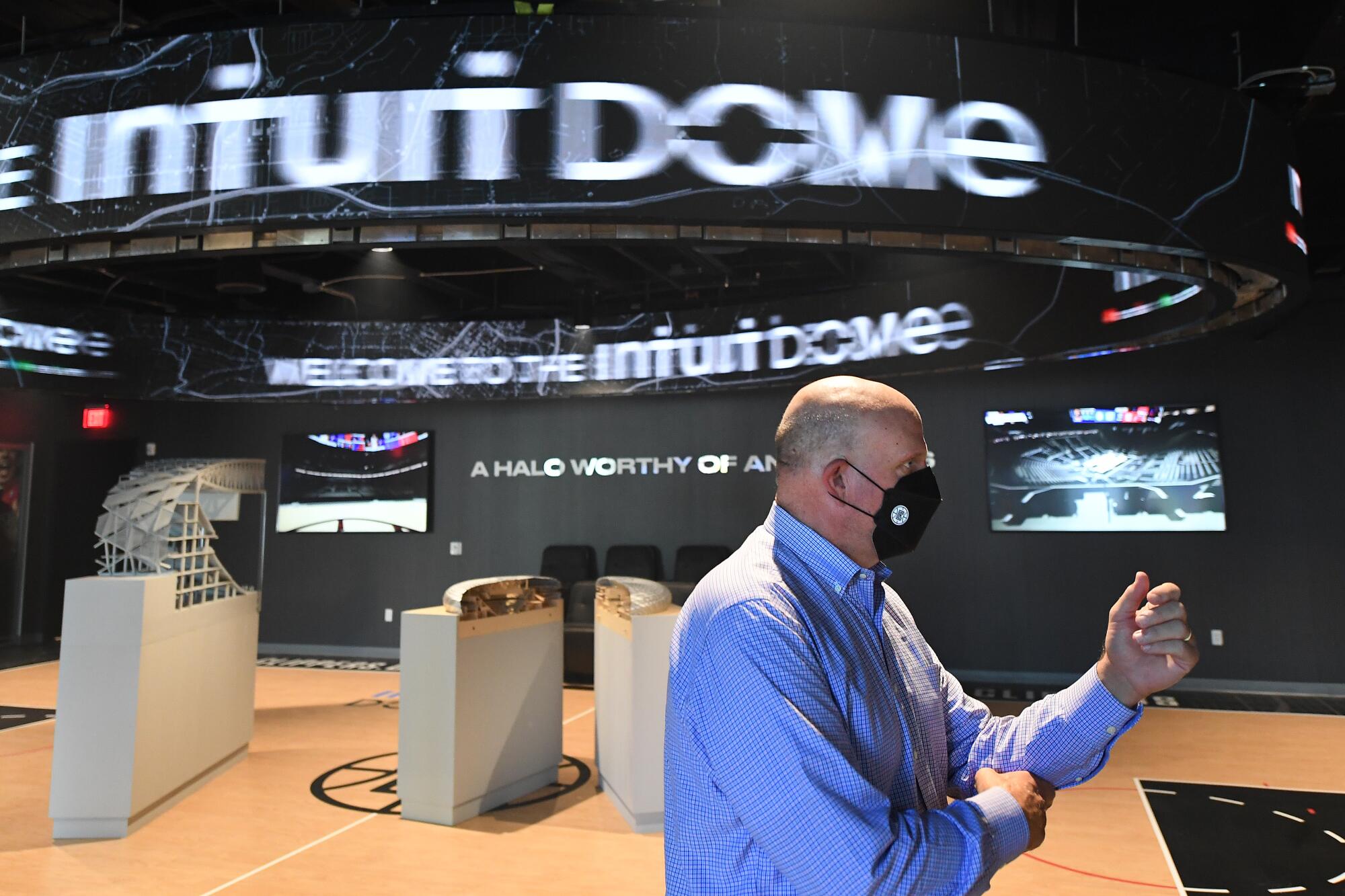 Clippers owner Steve Ballmer stands in front of a model of The Intuit Dome.