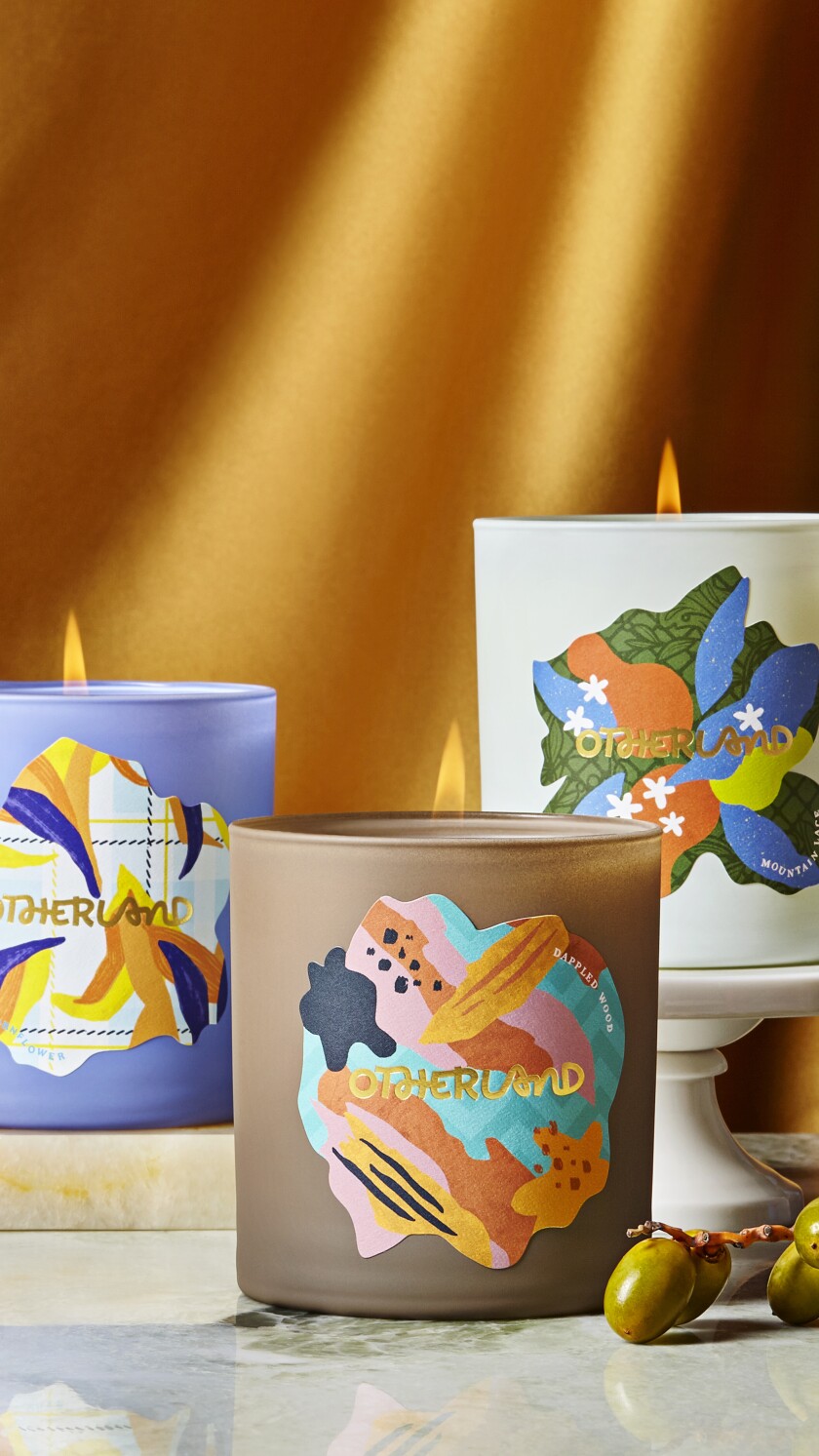 A collection of seasonal scented candles is on display.
