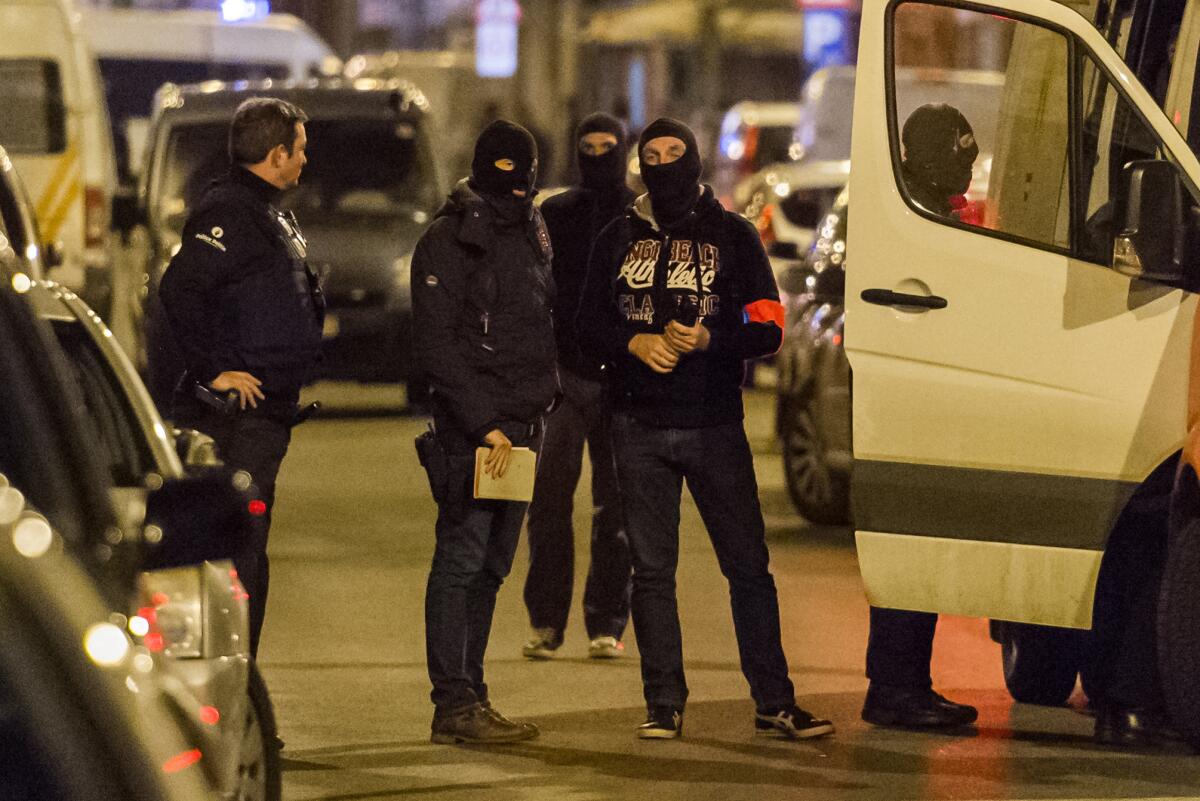 Police investigate an area where terror suspect Mohamed Abrini was arrested on Friday, April 8, 2016, in Brussels.