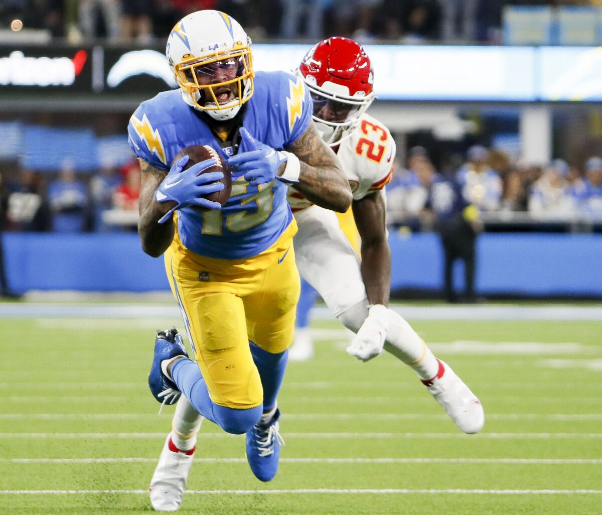Chargers receiver Keenan Allen catches a pass in front of Kansas City cornerback Joshua Williams