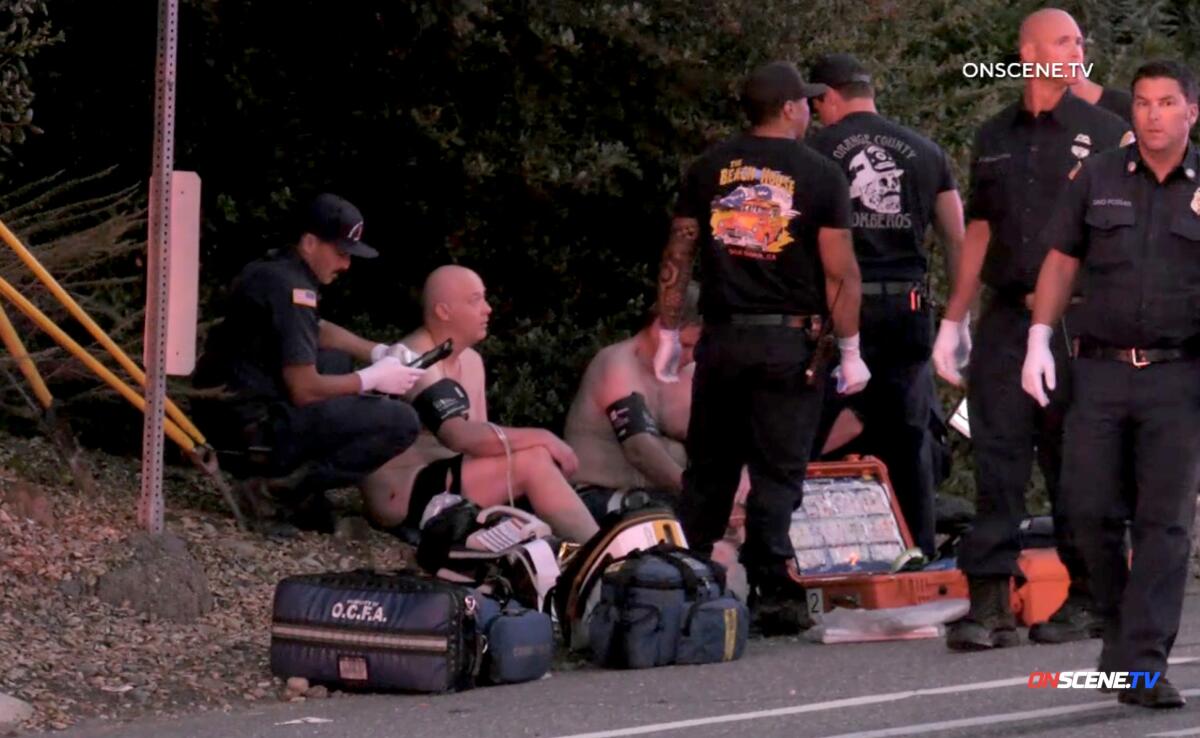 First responders treat people at the scene of a mass shooting at Cook's Corner in Trabuco Canyon.