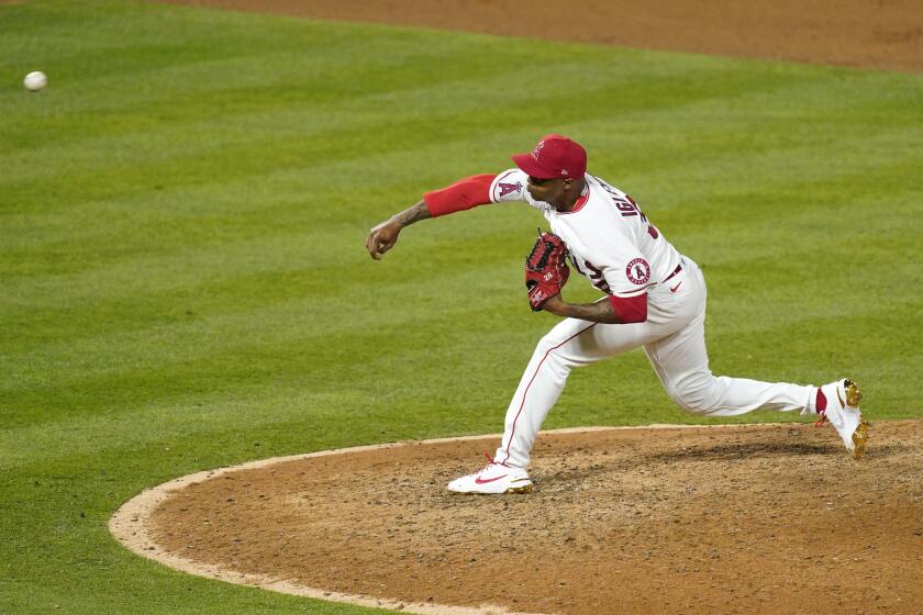 Los Angeles Angels relief pitcher Raisel Iglesias throws to the plate during the ninth inning of an Opening Day baseball game against the Chicago White Sox Thursday, April 1, 2021, in Anaheim, Calif. (AP Photo/Mark J. Terrill)