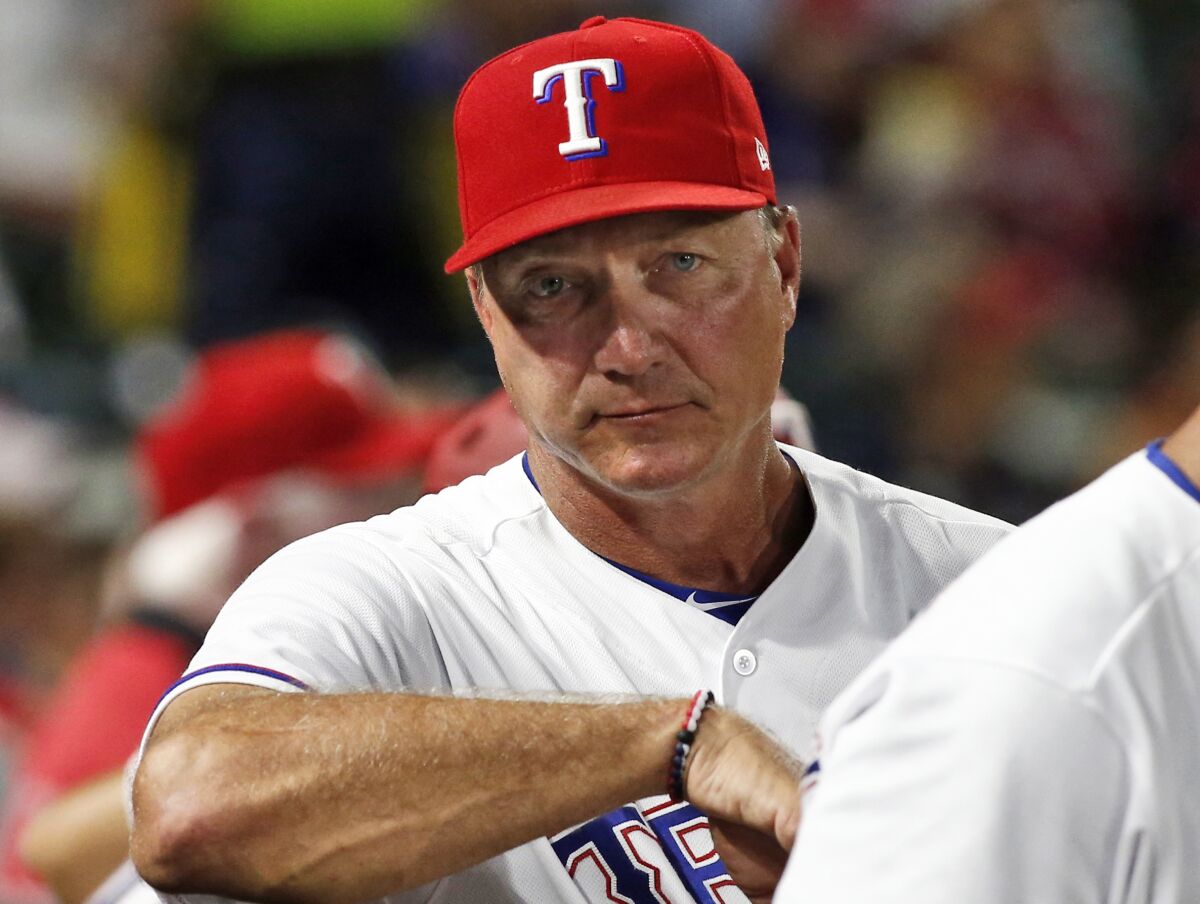 FILE - Texas Rangers manager Jeff Banister watches from the dugout during the seventh inning of a baseball game against the Tampa Bay Rays Tuesday, Sept. 18, 2018 in Arlington, Texas. The Arizona Diamondbacks hired Jeff Banister as the bench coach for manager Torey Lovullo on Monday, Nov. 1, 2021. (AP Photo/Mike Stone, File)