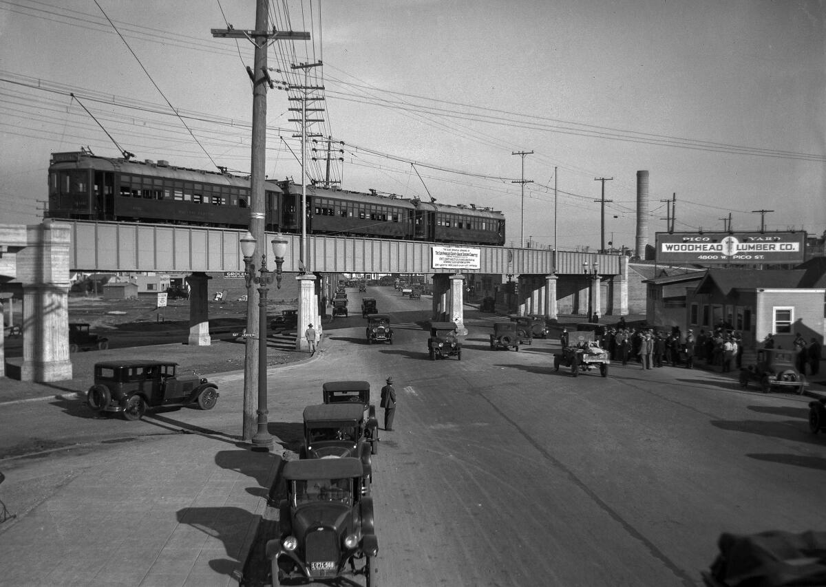 Nov. 2, 1927: A Pacific Electric Red Car train stopped on Pico Street viaduct with people and autos below. 