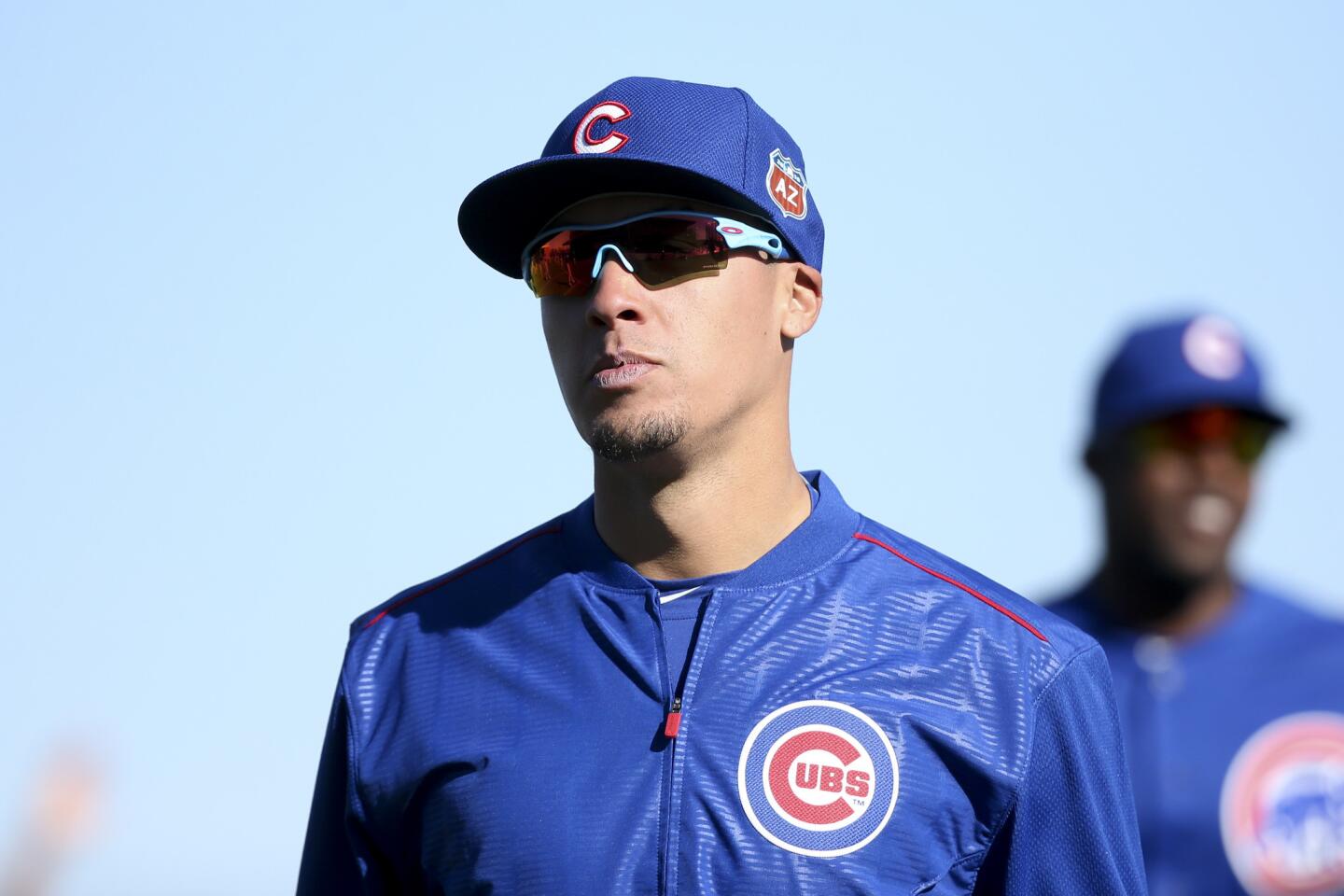 Javier Baez warms up with other players during spring training, Feb. 25, 2016.