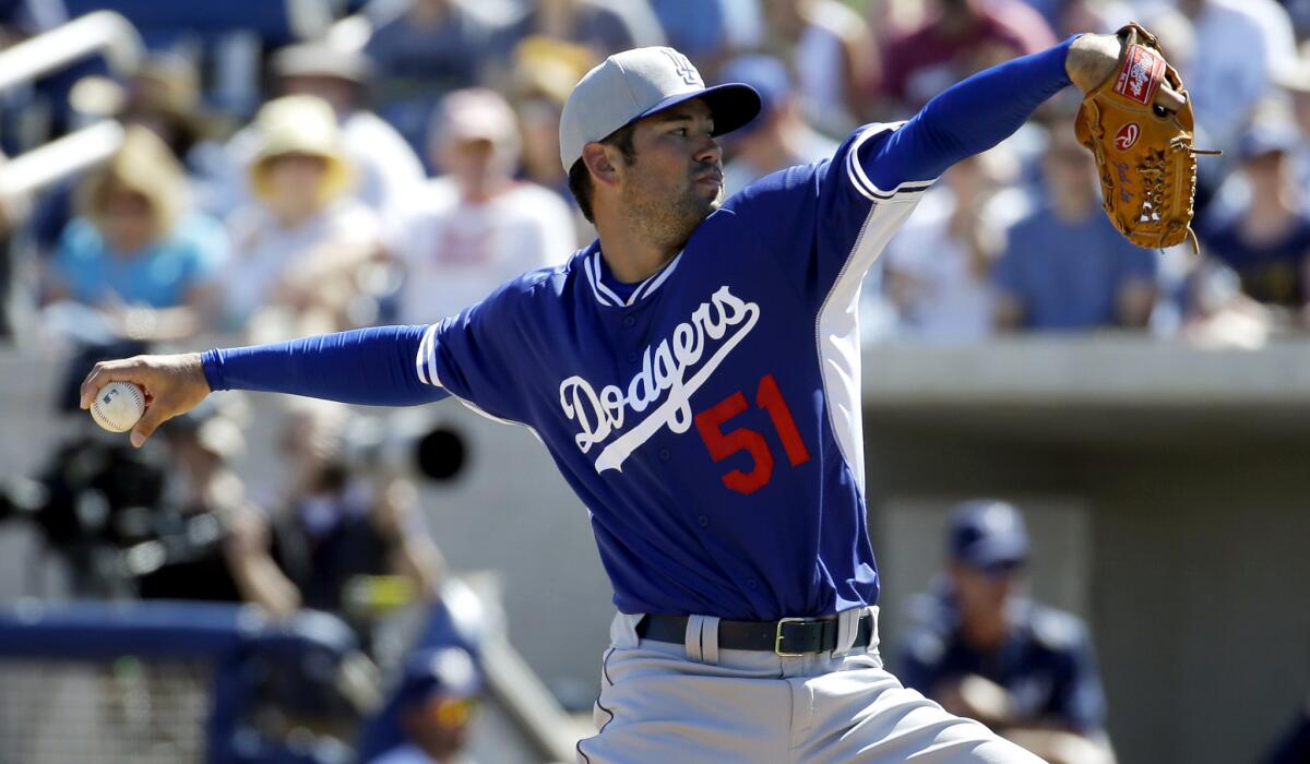 Dodgers pitcher Zach Lee throws during the second inning of a spring training baseball game against the Milwaukee Brewers on March 6.