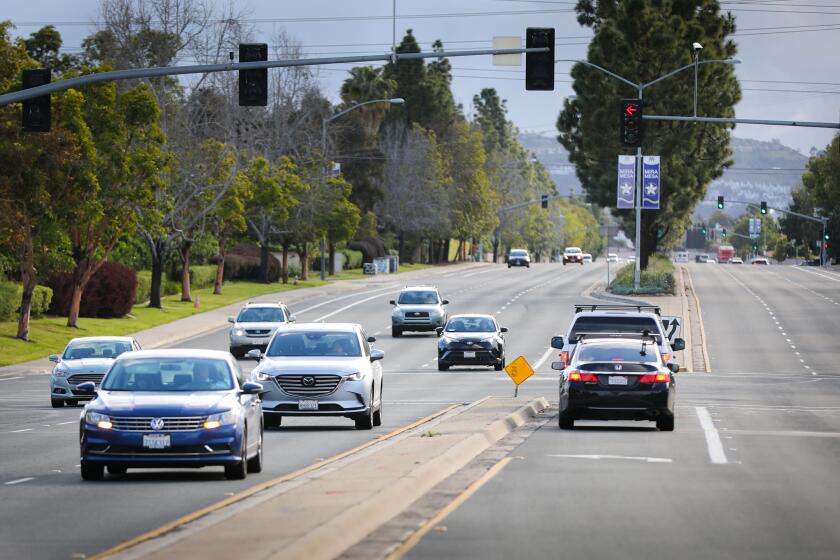 With schools and many businesses closed due to the coronavirus outbreak, traffic on Mira Mesa Boulevard at Camino Santa Fe, was unusually light at about 8:30 in morning, March 17, 2020 in San Diego, California. Generally it is very heavy.