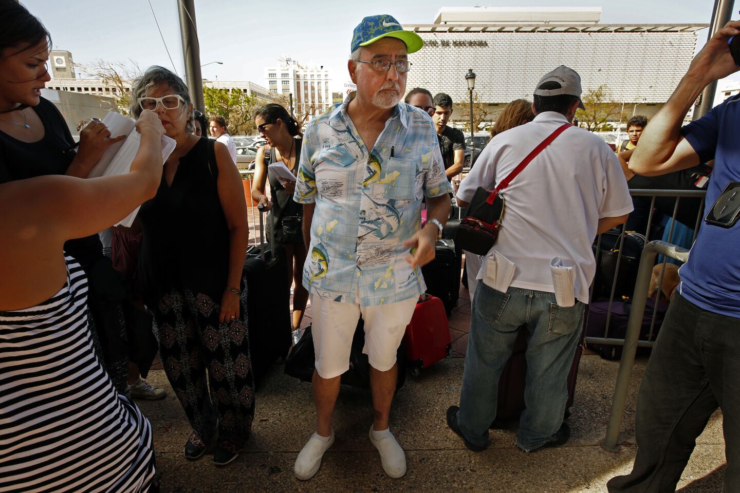 Luis Frankie, age 66, waits to board an evacuation cruise ship in San Juan.