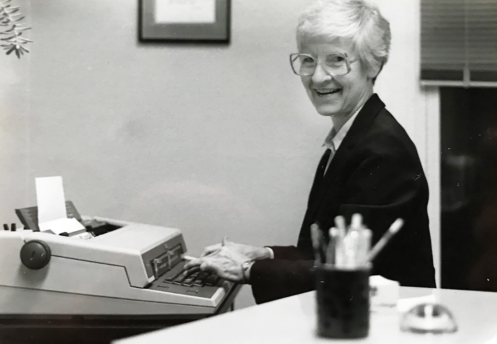 Sister Marie Brinkman writing in her office in Leavenworth, Kan., in 1984.