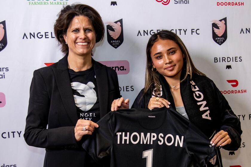 PLAYA VISTA, CA - JANUARY 12, 2023: Alyssa Thompson, 18, stands with Angel City Football Club President Julie Uhrman.