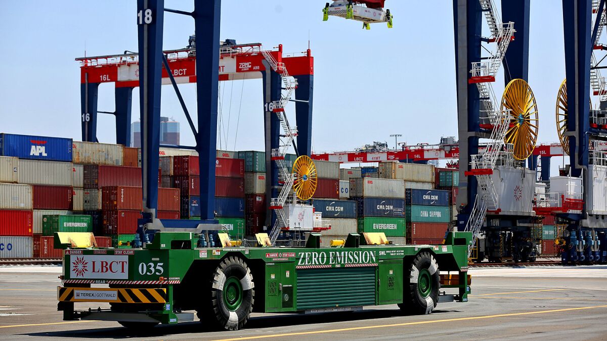A driverless, electric-powered vehicle is seen at the Port of Long Beach. Maersk and APM Terminals say proposed battery-powered vehicles would replace diesel rigs as a response to the Port of L.A.’s clean-air rules.