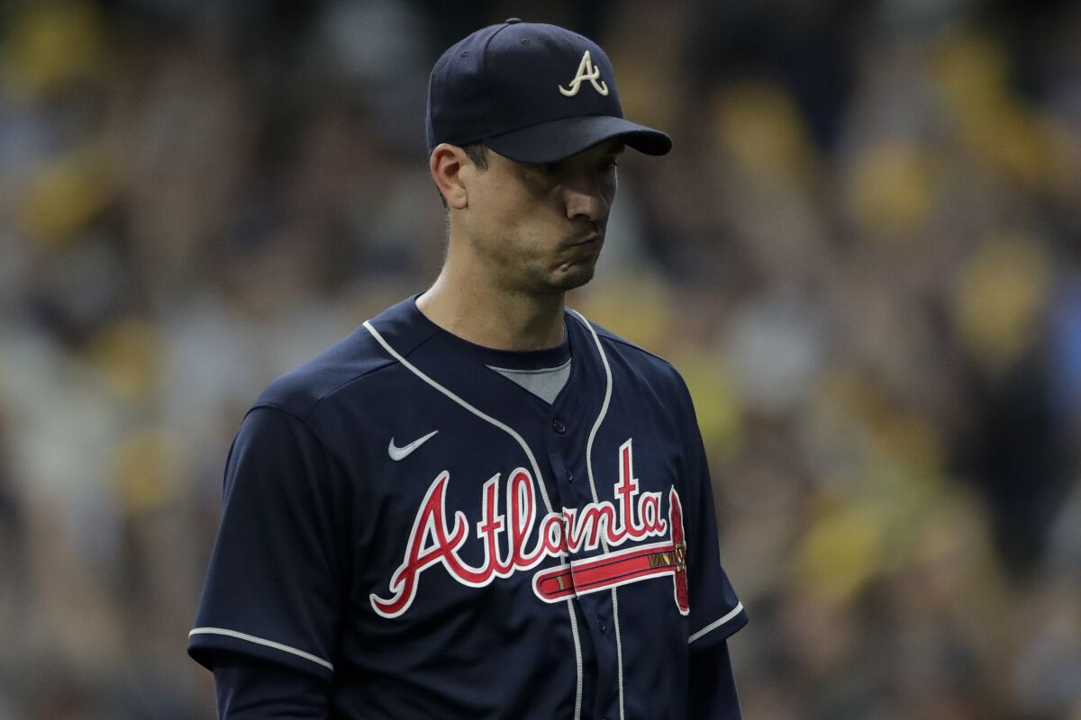 Atlanta Braves starting pitcher Charlie Morton reacts after leaving the game against the Milwaukee Brewers during the seventh inning in Game 1 of baseball's National League Divisional Series Friday, Oct. 8, 2021, in Milwaukee. (AP Photo/Aaron Gash)