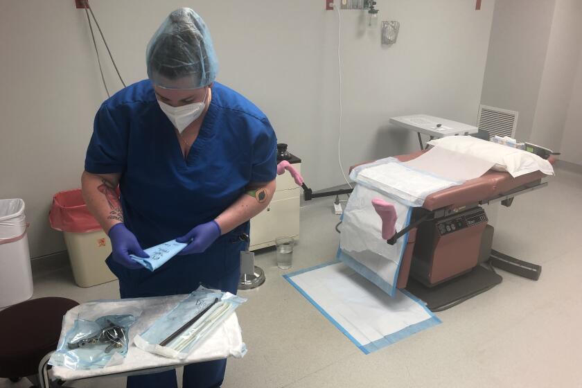 Trust Women abortion clinic director Ashley Brink prepares a room at the clinic in Wichita, Kansas.