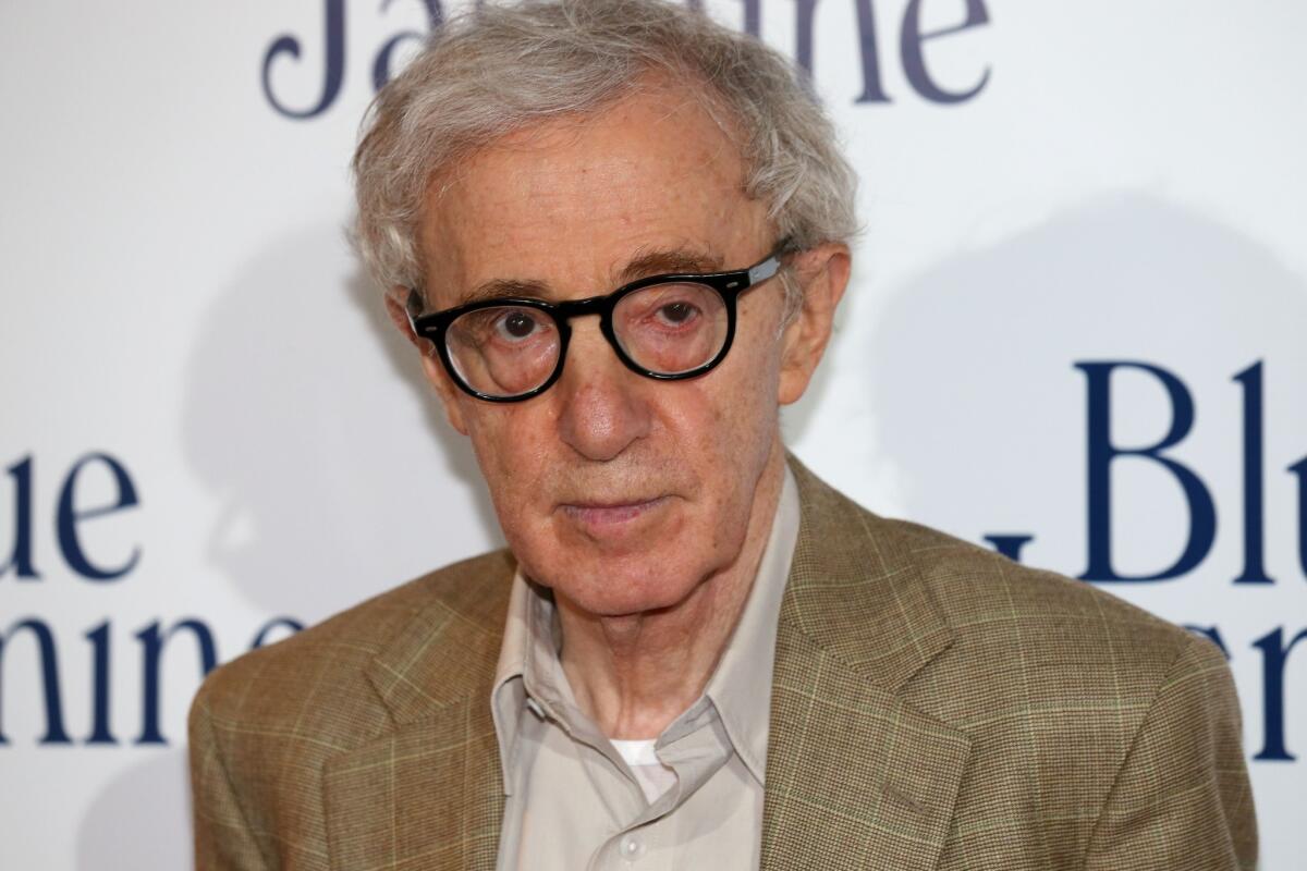 Woody Allen posing during the French Premiere screening of "Blue Jasmine."