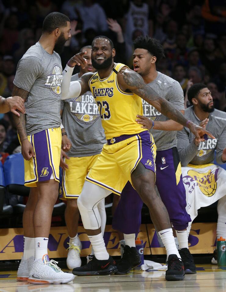 LeBron James celebrates getting fouled and making a three-pointer during the second half of a game against the Bucks on March 6 at Staples Center.