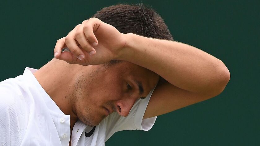 Australia's Bernard Tomic lost to Germany's Mischa Zverev during the first round match of Wimbledon on Tuesday.