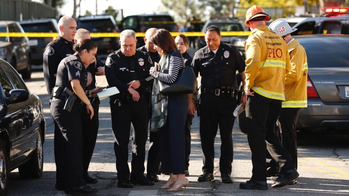 Los Angeles schools are at risk because of inconsistent campus safety measures and a need for more mental health services, according to a report released Monday. Officers manage security at Castro Middle School in Westlake following gunfire that wounded two students in February.