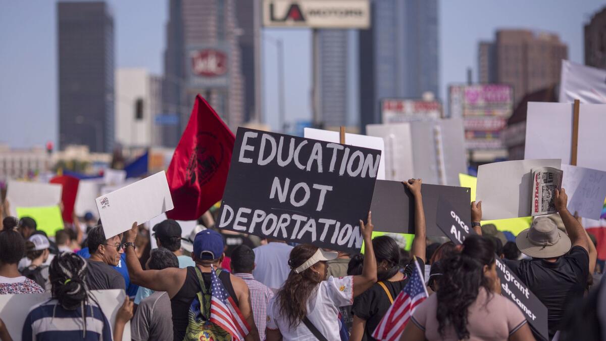 Thousands of immigrants and supporters joined the Defend DACA March in Los Angeles in September to oppose President Trump's order phasing out protections for young people brought to the country illegally as children.