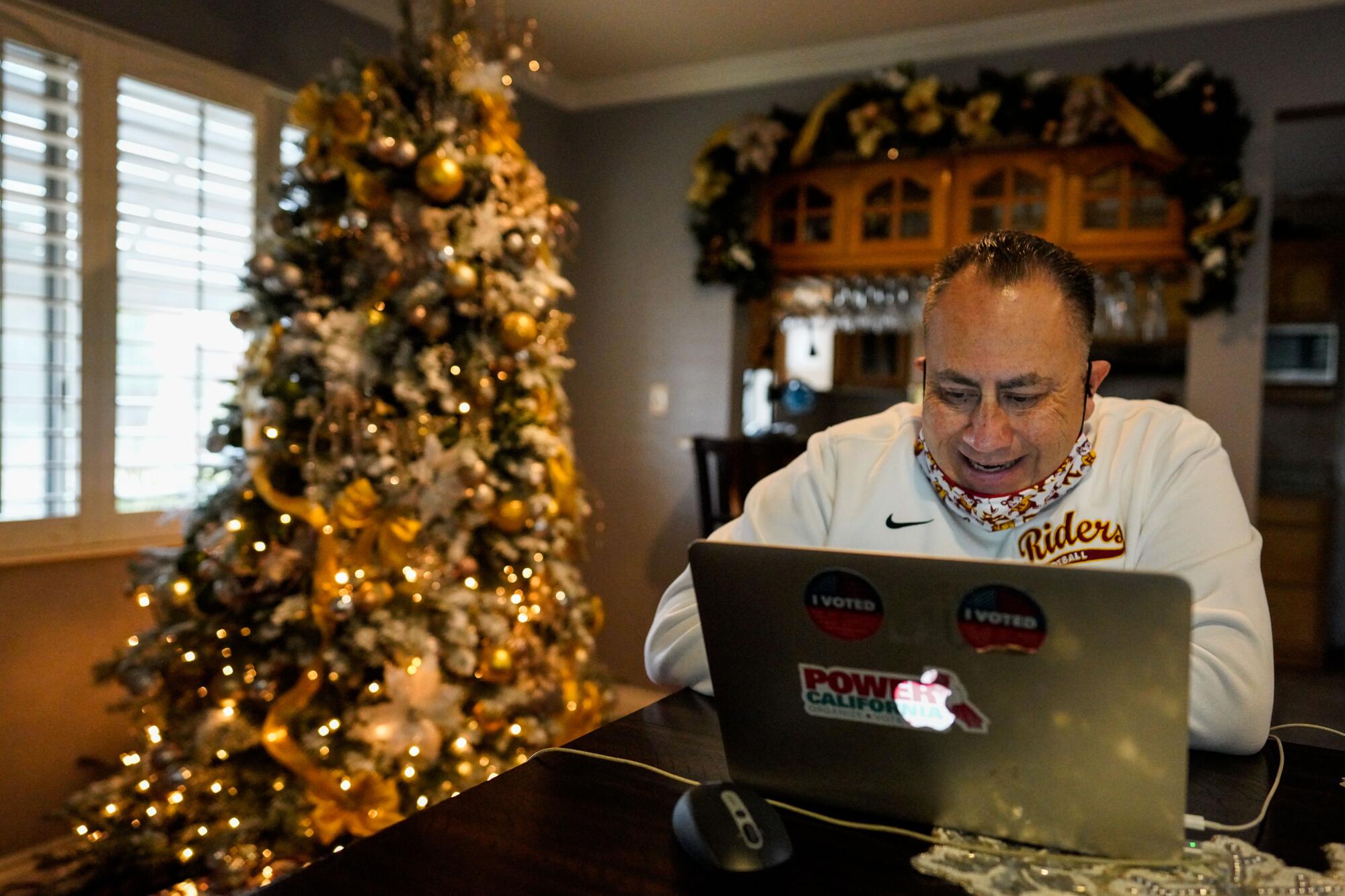 Roosevelt football coach Aldo Parral conducts team practice during a Zoom videoconference on Dec. 17.