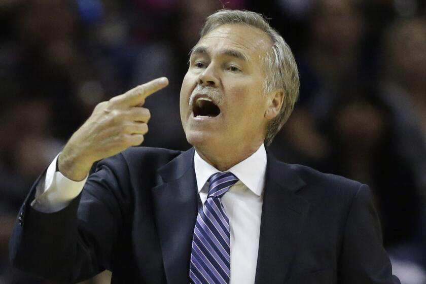 Lakers Coach Mike D'Antoni directs the Lakers during game against the Spurs in San Antonio.