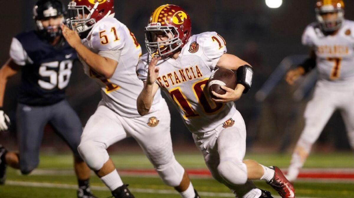 Estancia High running back Trevor Pacheco carries the ball against Calvary Chapel on Sept. 27. Pacheco has 14 touchdowns this season.