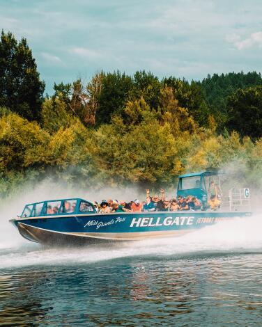 Hellgate jetboat speeding along the Rogue River.